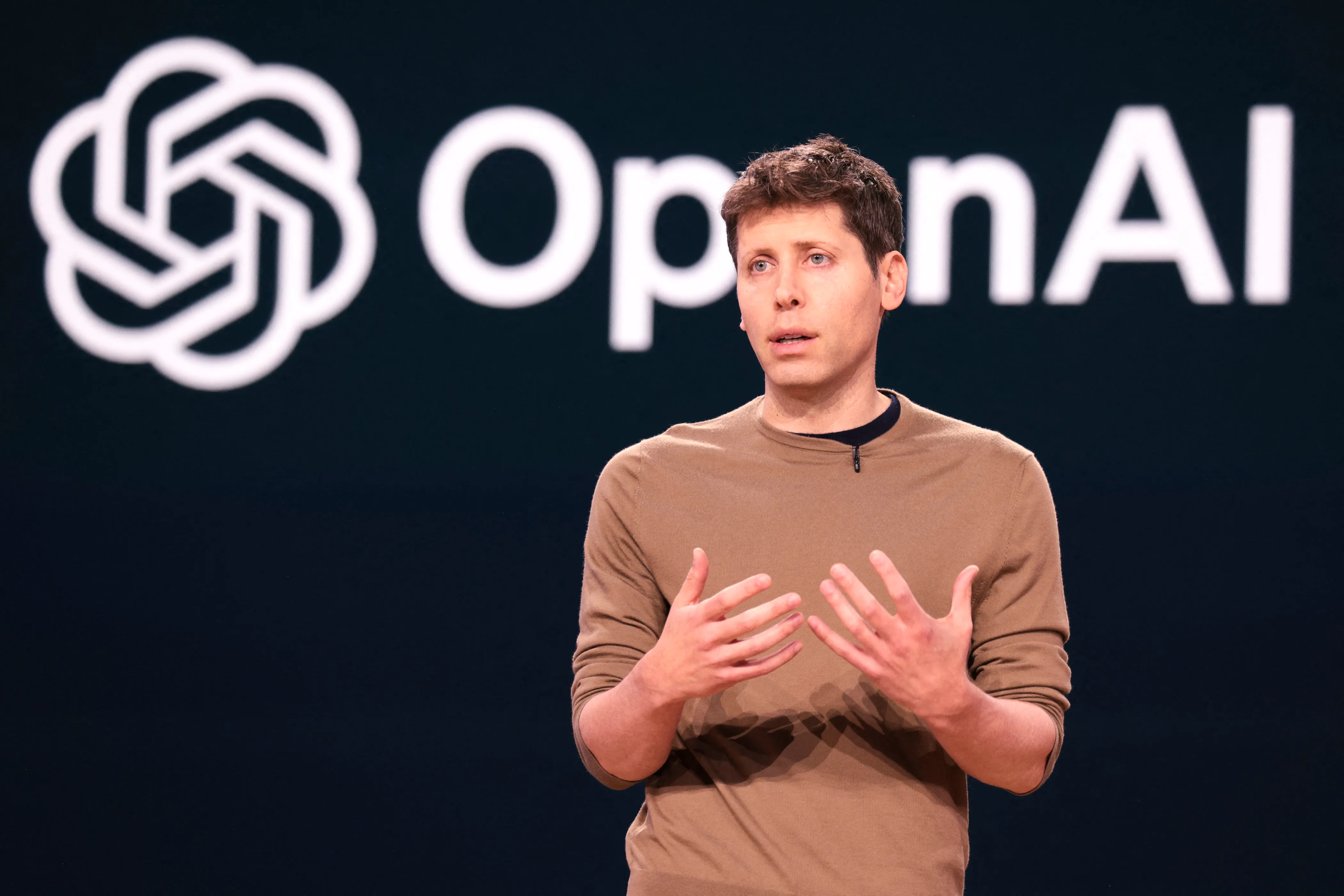 Sam Altman speaking on stage